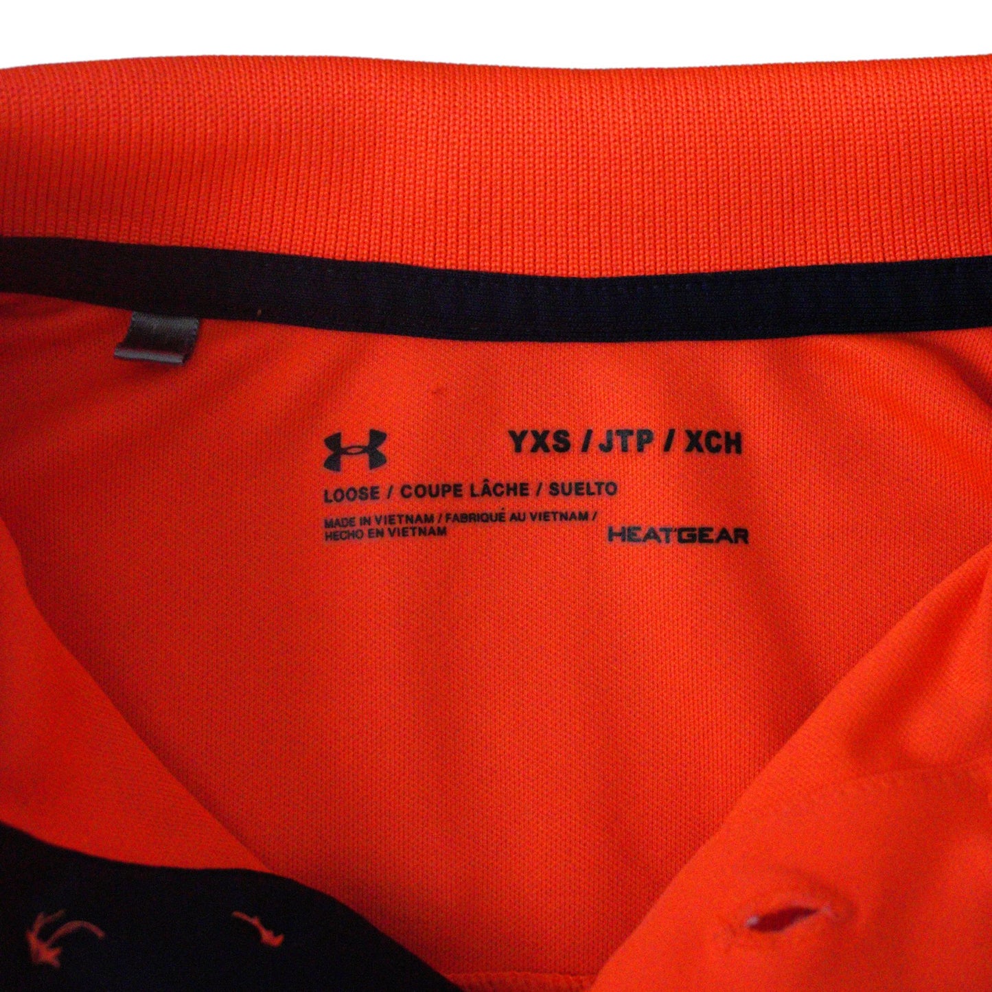 Polo naranja de Under Armour para niños, talla XS